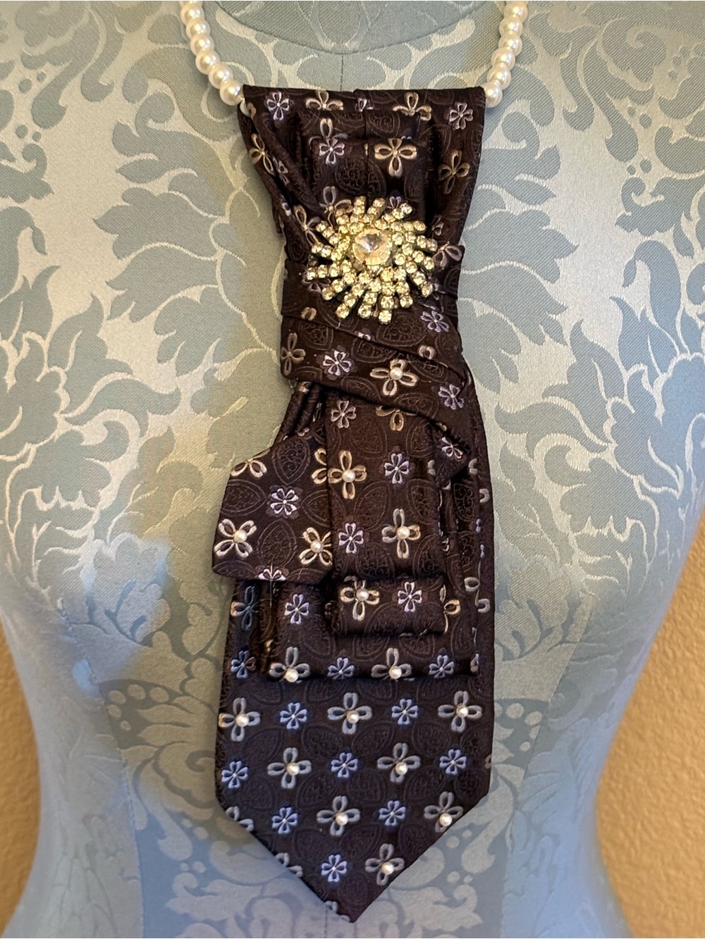 Embellished Black Floral Necktie necklace with rhinestone brooch.